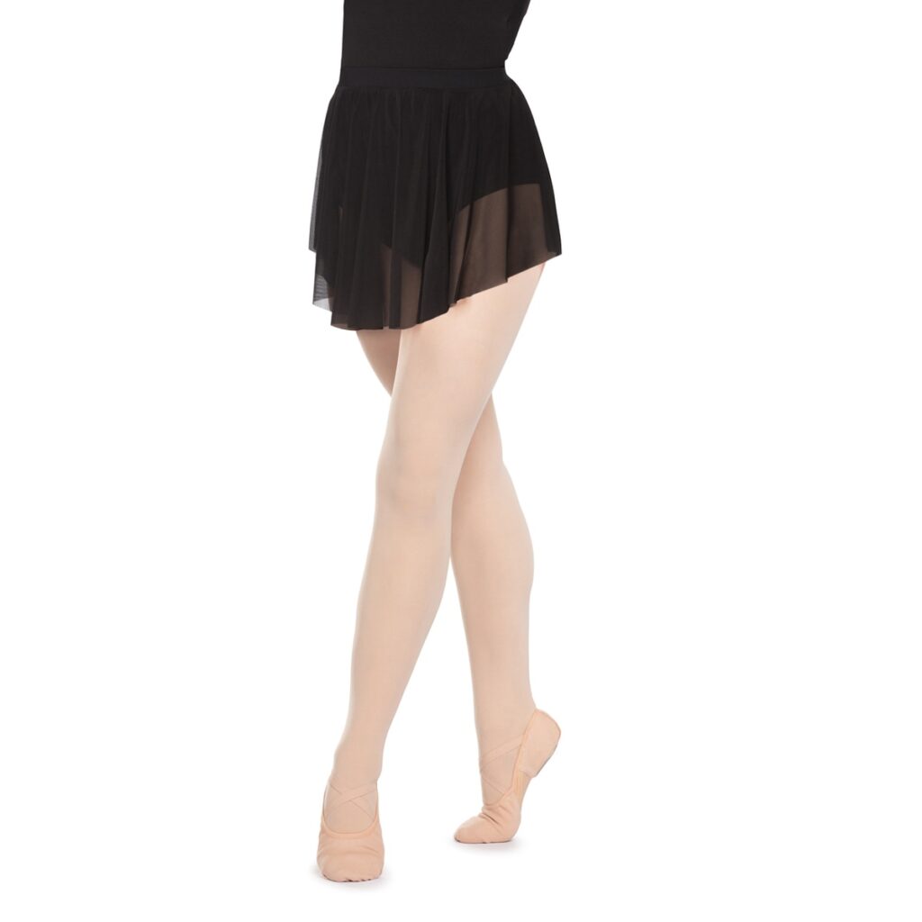 Ballet dancer wearing a black skirt and standing on tiptoe.