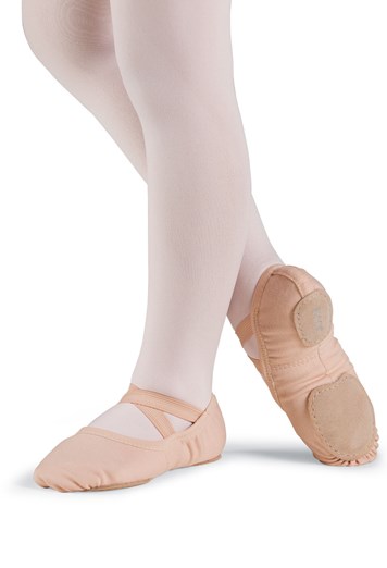 Ballet dancer's feet in pink ballet slippers and tights.