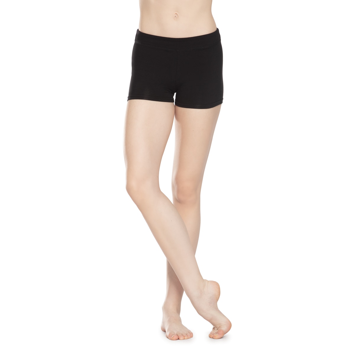 Woman wearing black fitted shorts, standing barefoot.