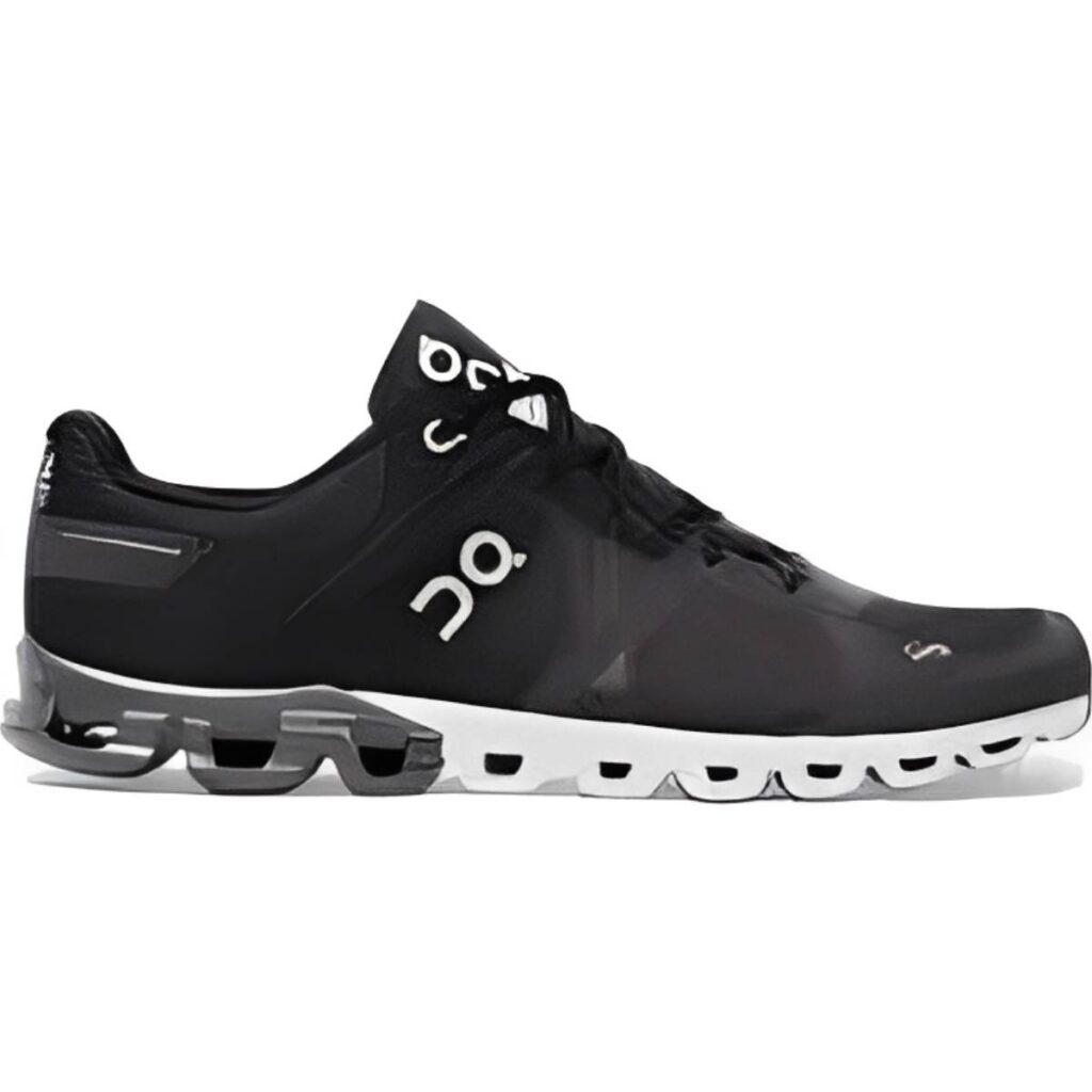 Black and white athletic shoe with cushioned sole and laces.