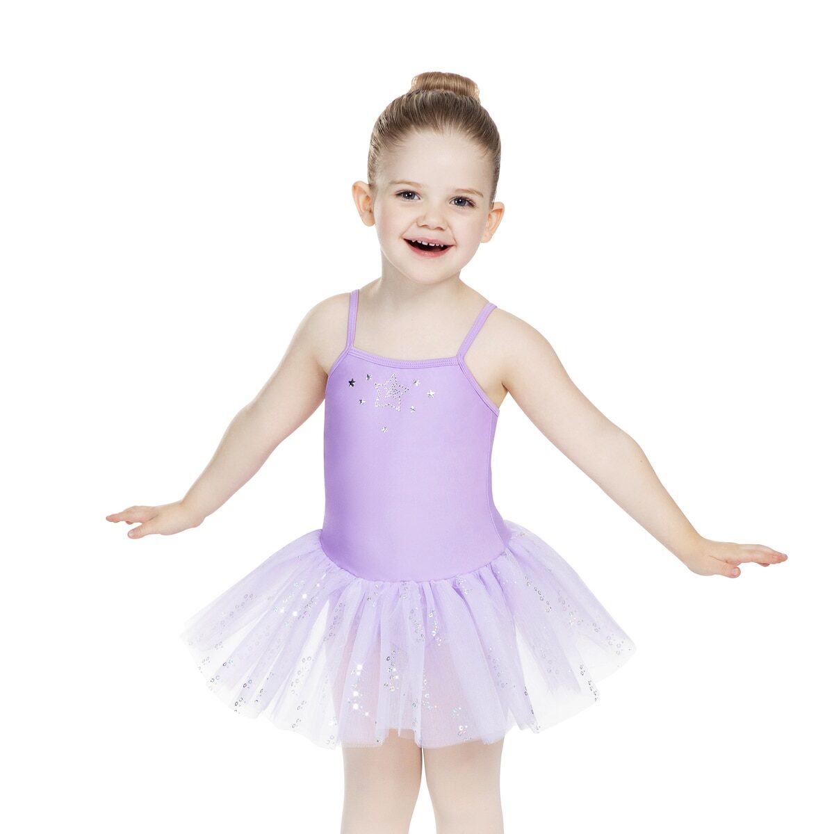 Young girl in a purple ballet dress posing with arms outstretched.