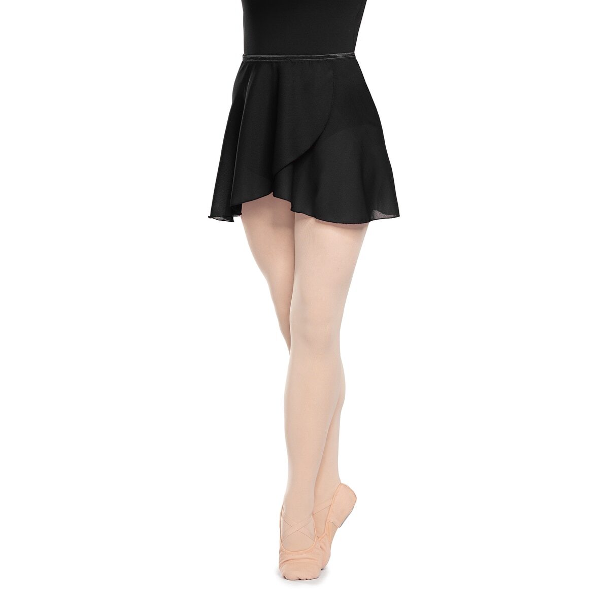 Ballet dancer in a black skirt standing on tiptoe.